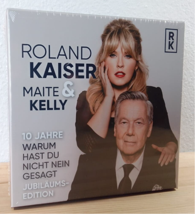 Roland Kaiser / Maite Kelly - "Warum hast Du nicht nein gesagt“ Jubiläumsbundle mit Schal & Autogrammkarte — Artikel auf Lager